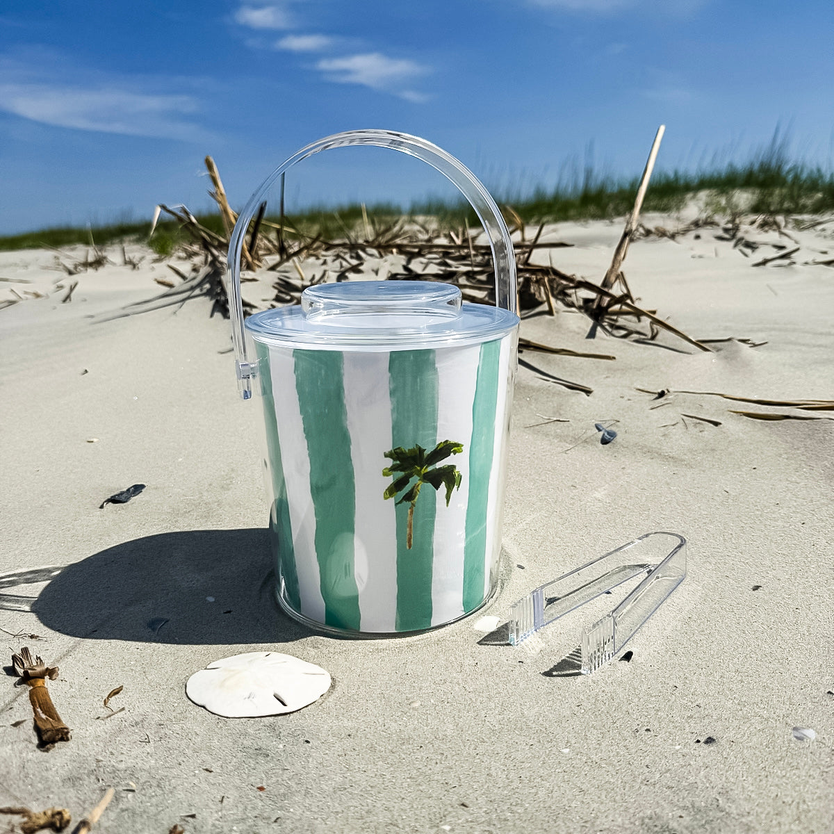 Ice bucket with tongs made from clear Lucite acrylic. Coastal design with removable lid for easy entertaining.