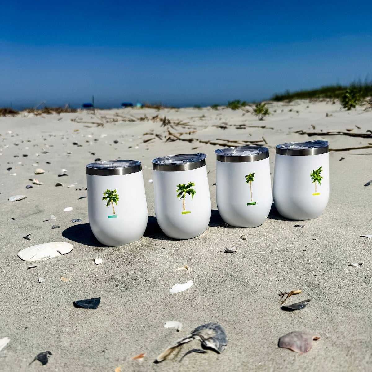 Coastal wine tumbler with double-wall insulation and slide-top lid—keeps drinks cold for 12 hours with coastal charm.