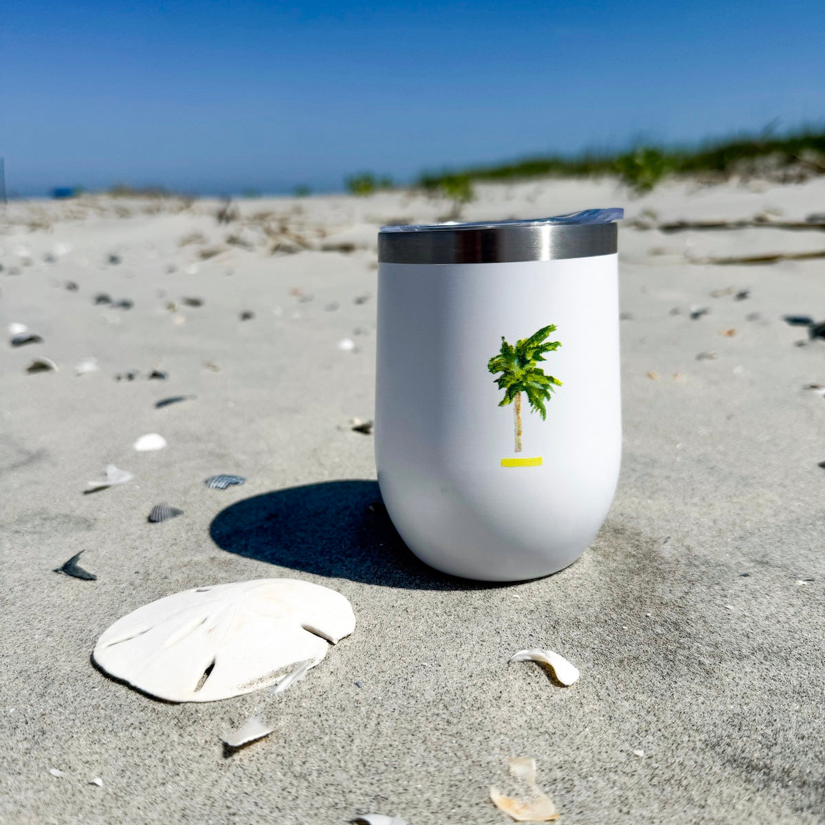 Coastal wine tumbler with double-wall insulation and slide-top lid—keeps drinks cold for 12 hours with coastal charm.