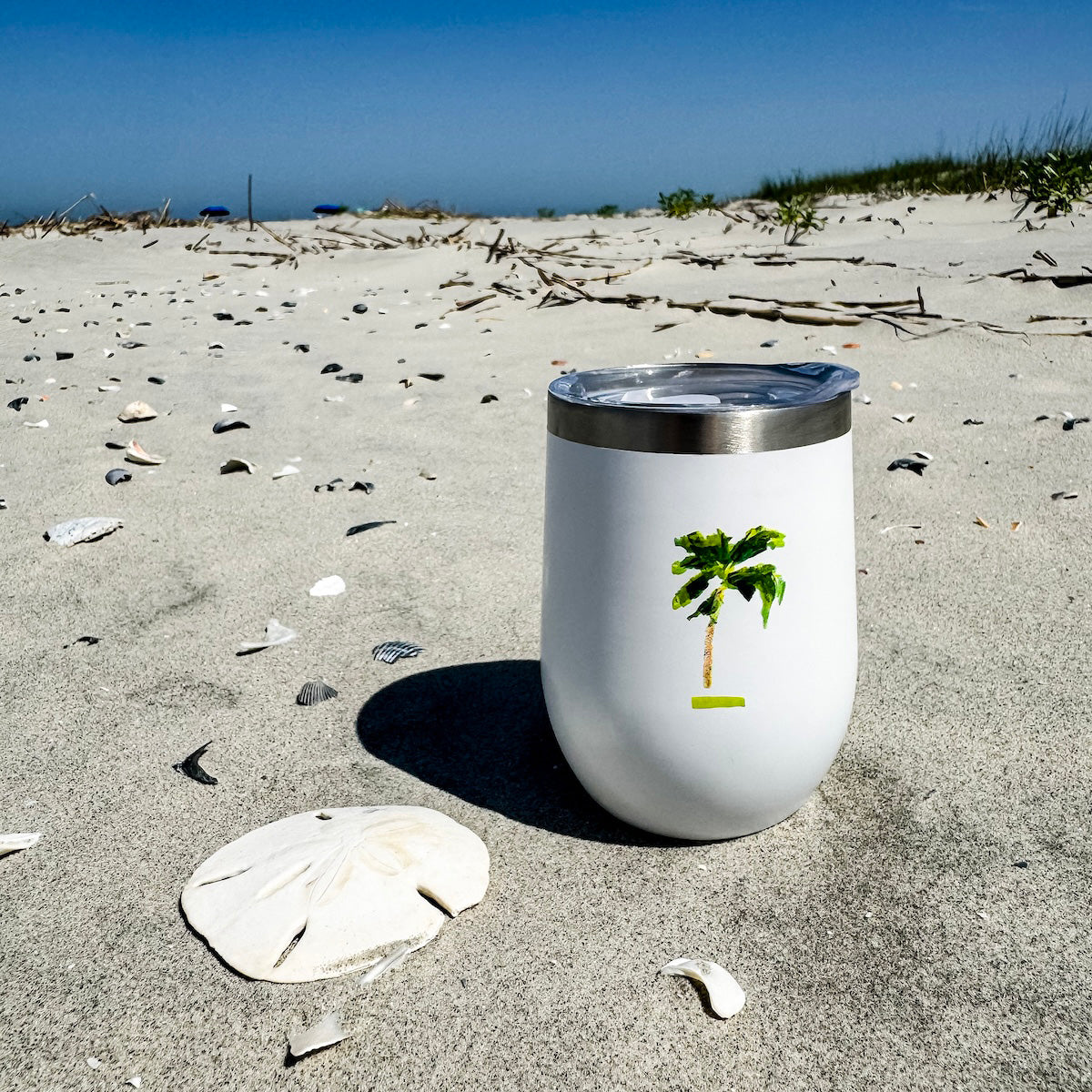 Coastal wine tumbler with double-wall insulation and slide-top lid—keeps drinks cold for 12 hours with coastal charm.