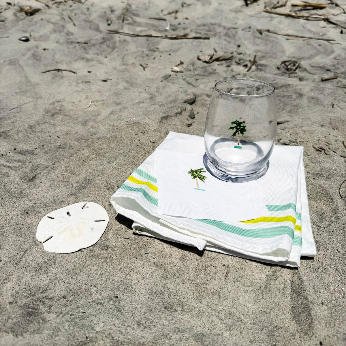 White coastal cocktail napkins, made from soft, three-ply paper with a smooth texture and custom design, are perfect for relaxed entertaining.