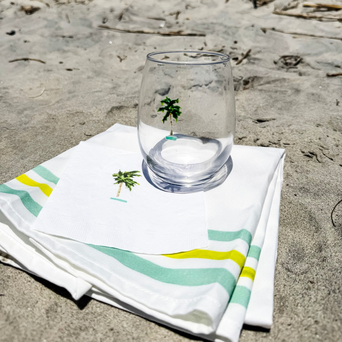 White coastal cocktail napkins, made from soft, three-ply paper with a smooth texture and custom design, are perfect for relaxed entertaining.