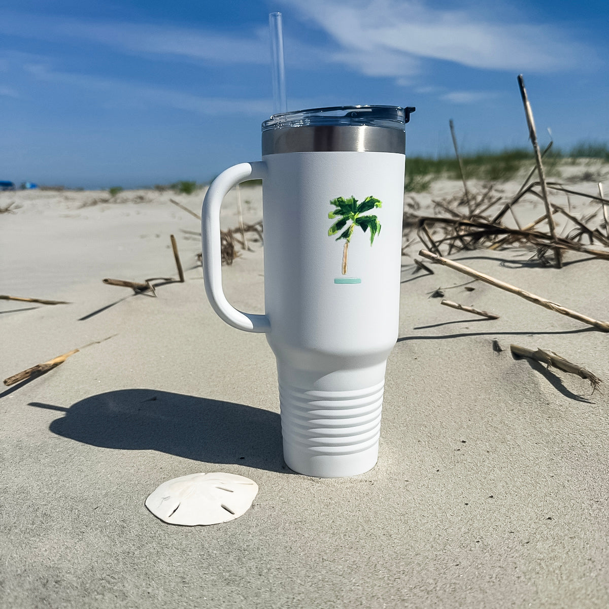 Insulated travel mug with coastal design is 40oz, double-wall stainless steel, and straw—keeps drinks cold or hot for hours.