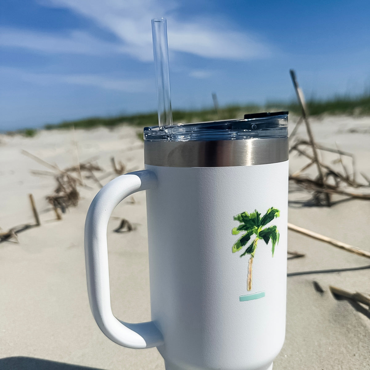 Insulated travel mug with coastal design is 40oz, double-wall stainless steel, and straw—keeps drinks cold or hot for hours.
