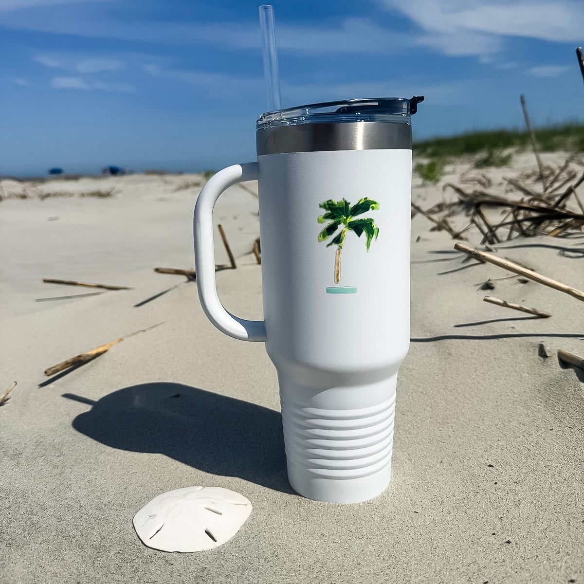 Insulated travel mug with coastal design is 40oz, double-wall stainless steel, and straw—keeps drinks cold or hot for hours.