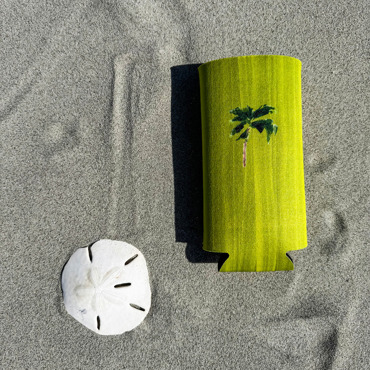 Coastal slim can cooler fits slim 12oz cans. Keeps your drink chill and your vibe coastal.