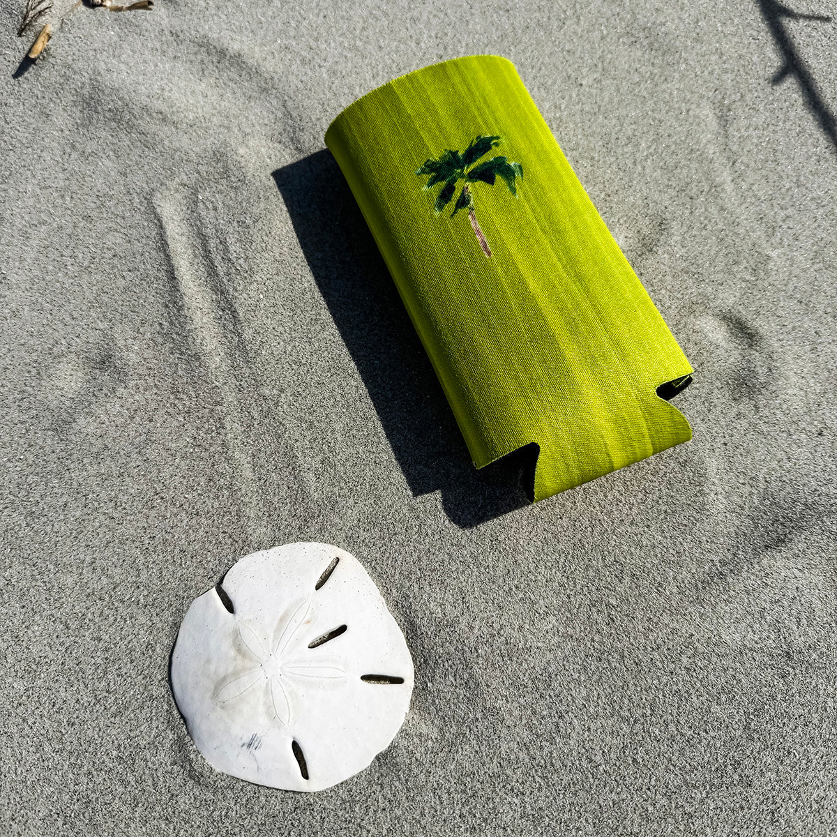 Coastal slim can cooler fits slim 12oz cans. Keeps your drink chill and your vibe coastal.