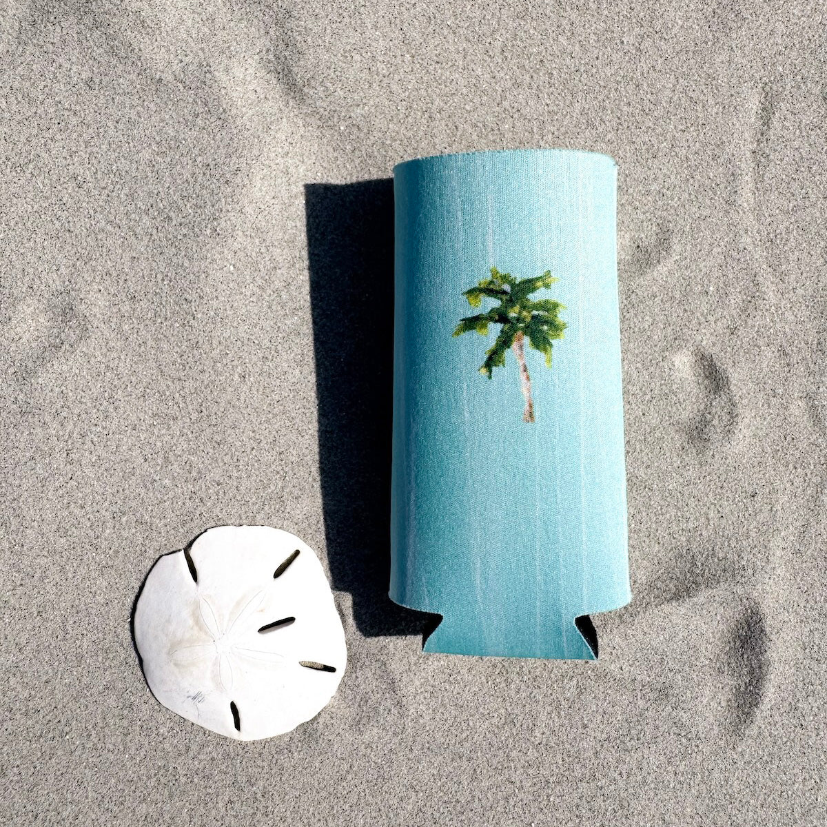 Coastal slim can cooler fits slim 12oz cans. Keeps your drink chill and your vibe coastal.