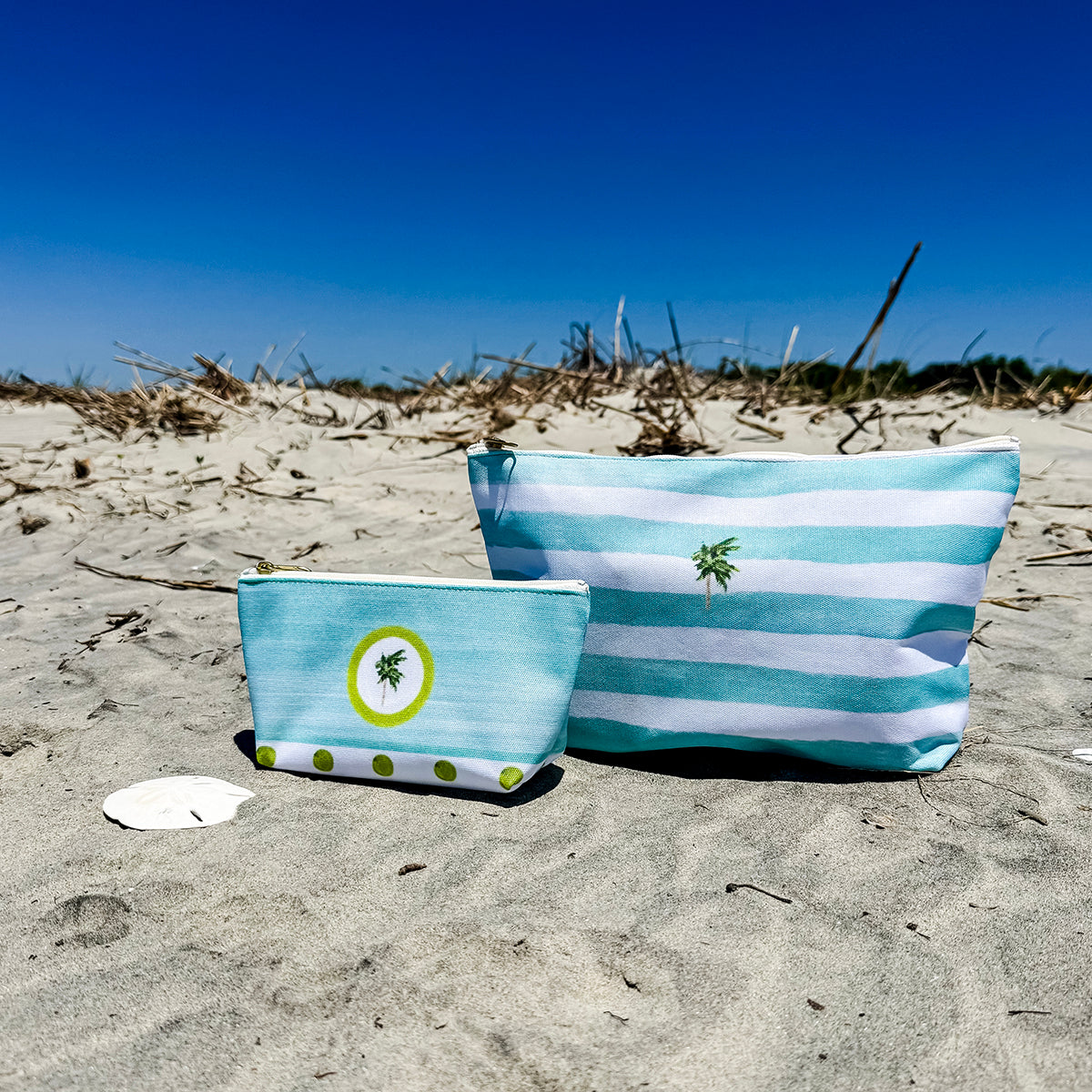 Coastal accessory bag with zip closure and T-bottom shape—perfect for makeup, travel, or beach day gear.