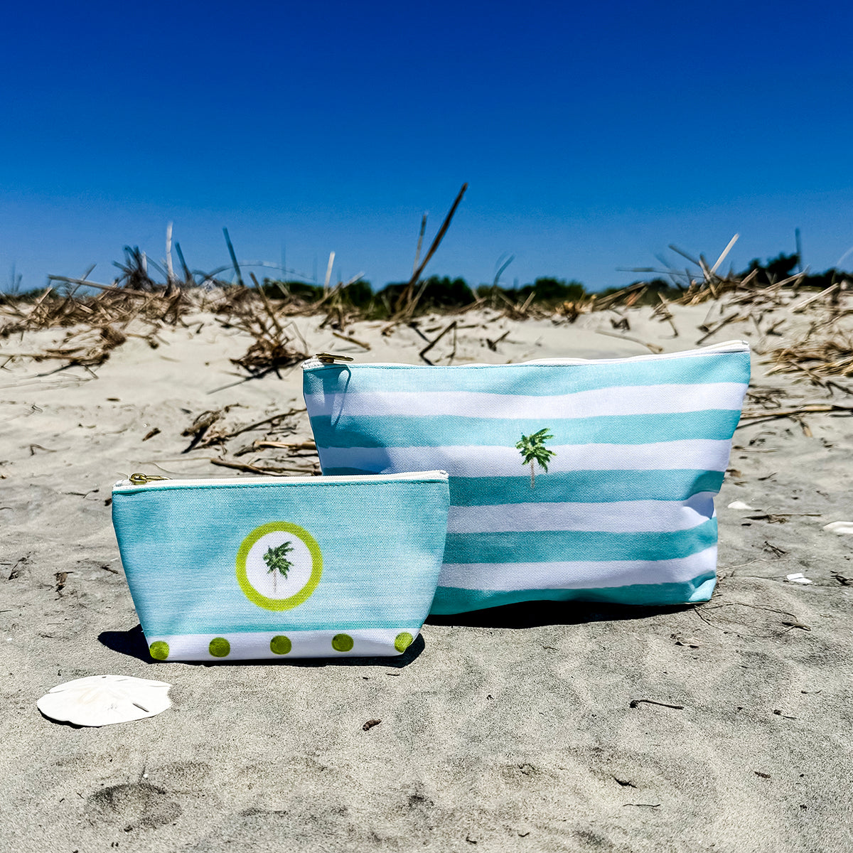 Coastal accessory bag with zip closure and T-bottom shape—perfect for makeup, travel, or beach day gear.