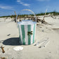 Ice bucket with tongs made from clear Lucite acrylic. Coastal design with removable lid for easy entertaining.