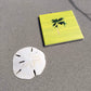 Coastal ceramic coaster with cork backing—square design for hot or cold drinks, easy to clean, and full of coastal charm.