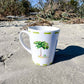 Ceramic latte mug with rounded corners and handle—12oz of comfort for your coffee routine. Coastal Christmas latte mug.
