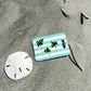 Coastal luggage tag in rectangle, 4” size with double-sided print—coastal style for easy bag spotting.